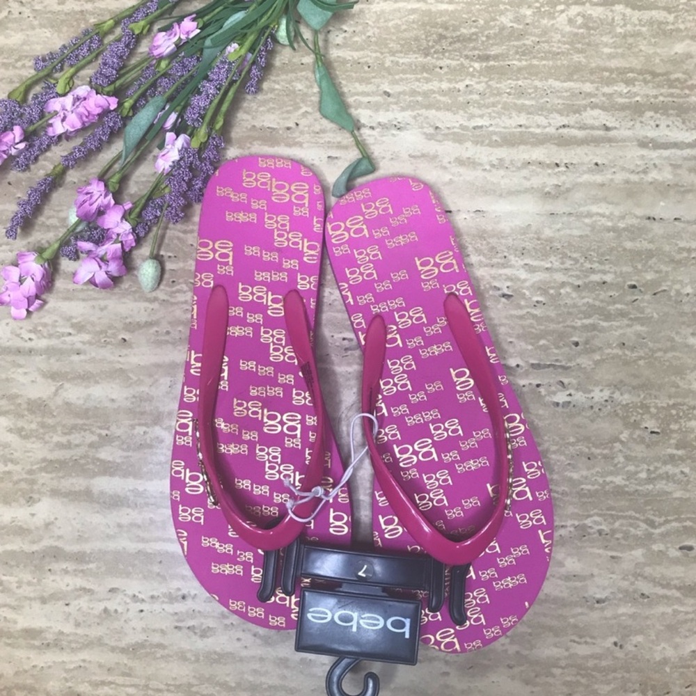 Bebe pink flip flops with rhinestones. Size 7